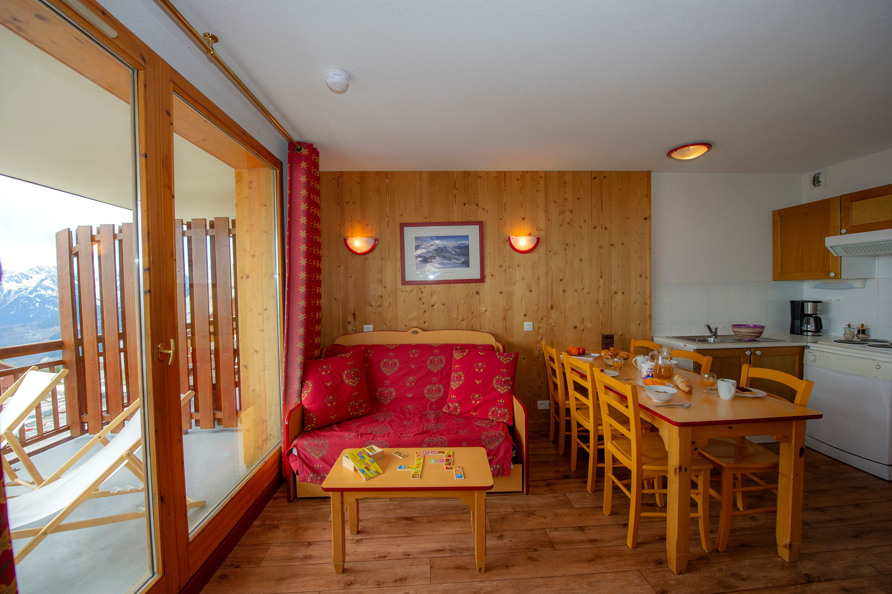 image The living area brings together the sofa, dining table and kitchenette.
