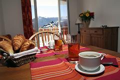 image Enjoy a warm breakfast with pastries, ready for a snowy adventure.