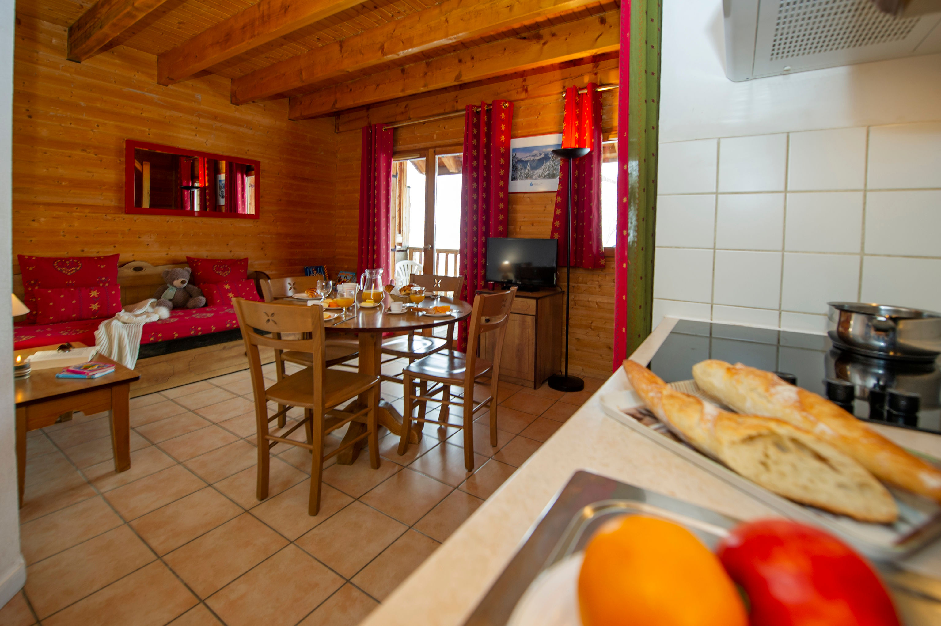 image Golden baguette sits warm on the countertop, with the induction hob and open kitchen just behind.