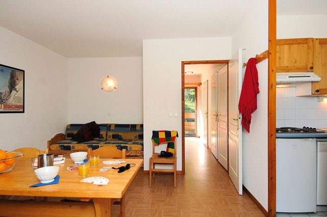image Wooden beams and a skylight bring natural light into the sitting area.