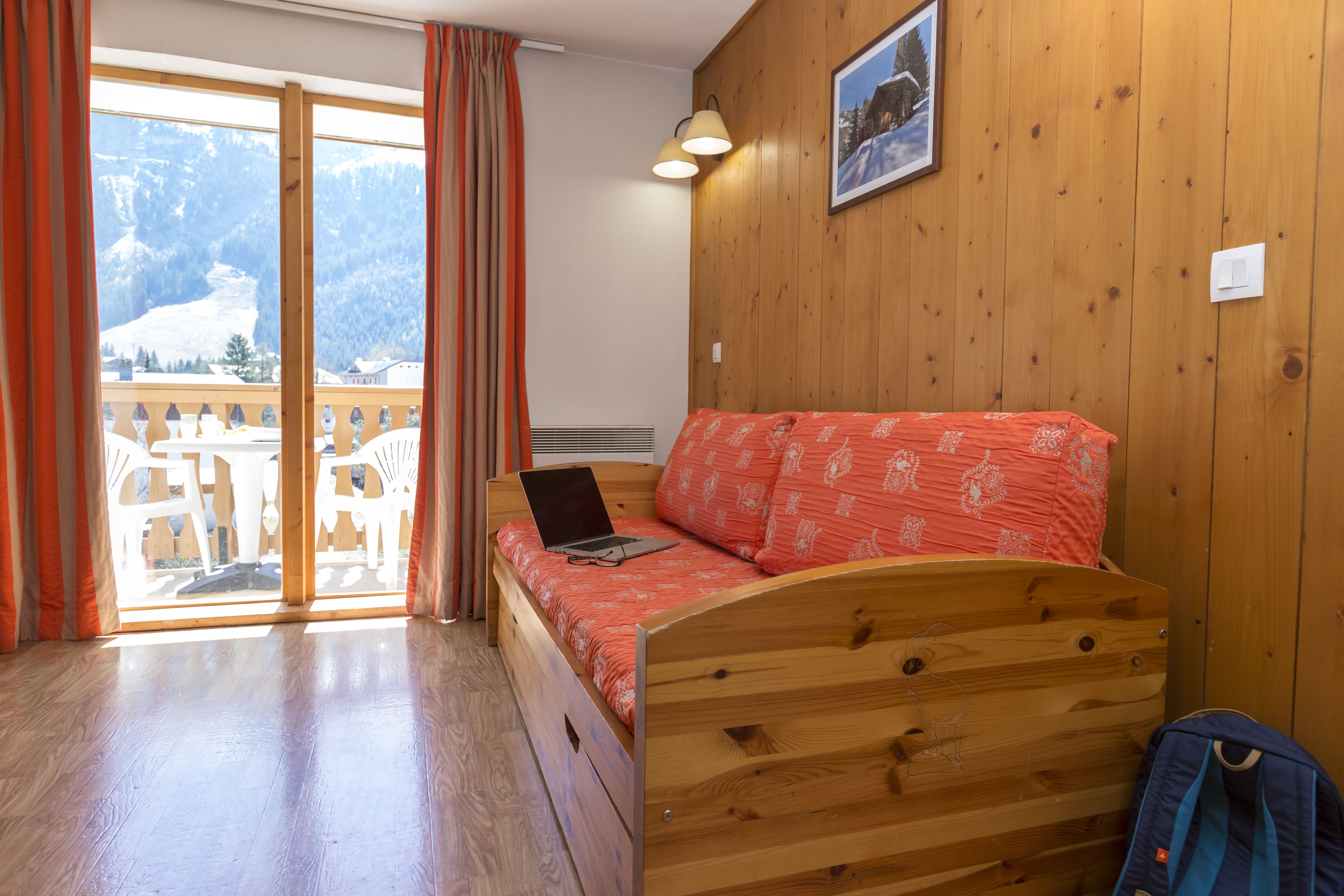 image Wood panelling runs across the walls, with a painting adding a splash of colour.