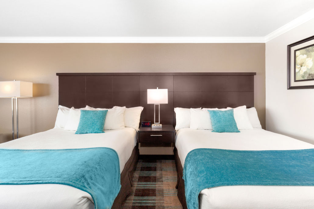 image A closer look at the two queen beds with headboards