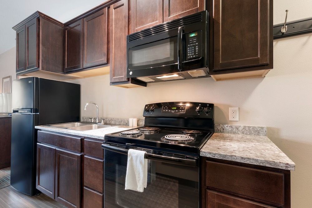 image Full kitchen with appliances and countertops