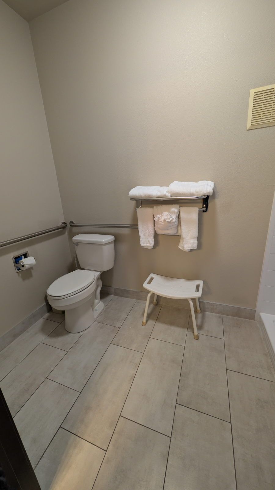 image Accessible bathroom with grab bars and shower