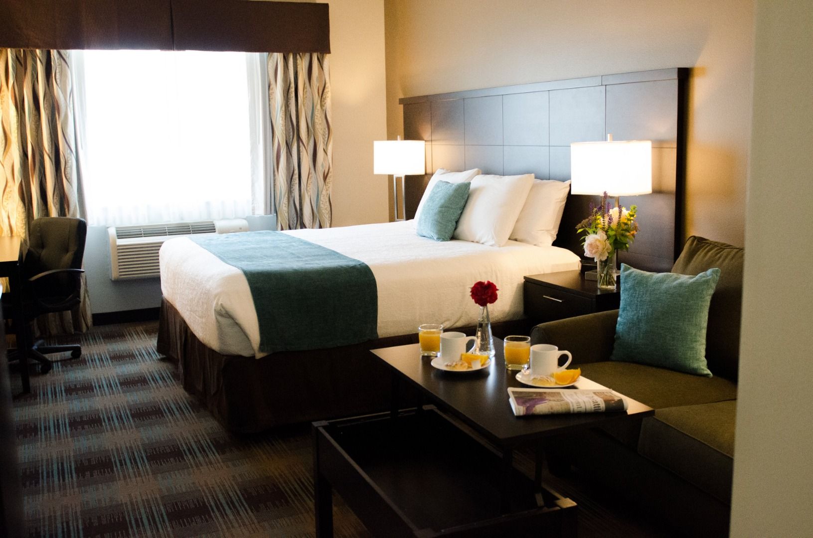 image King suite bedroom with sofa seating area and work desk
