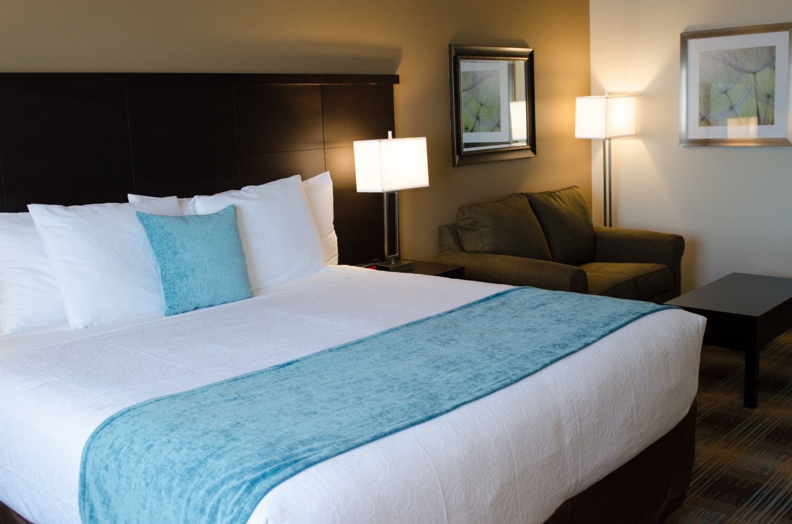 image King bed with soft linens and seating area