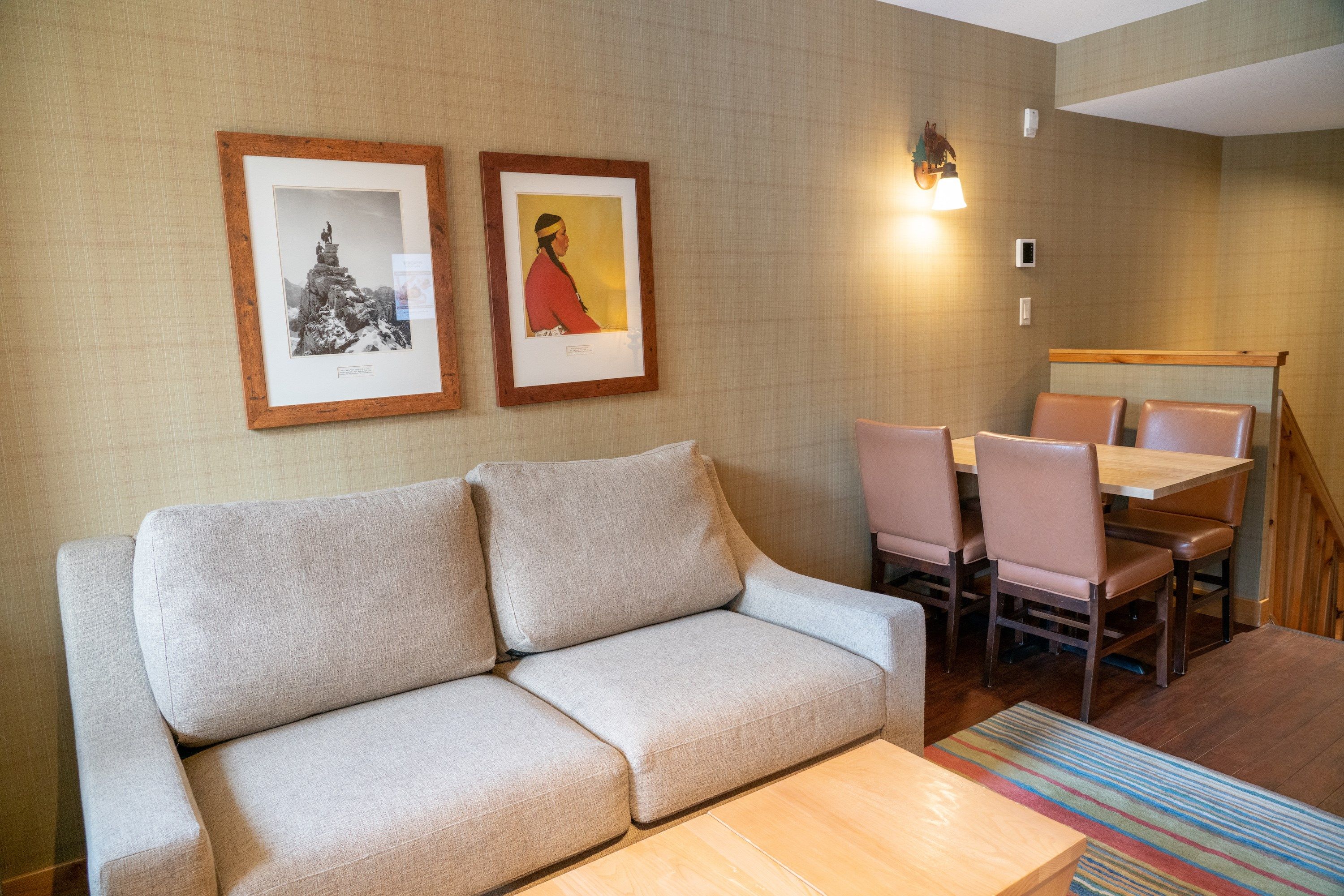 image Kick back your feet on the comfortable sofa in the open-plan living space, featuring chalet-inspired decor.