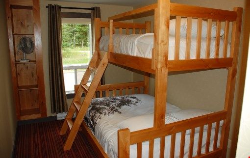 image The cozy single over double bunk bed is perfect for the kids or the kids at heart!