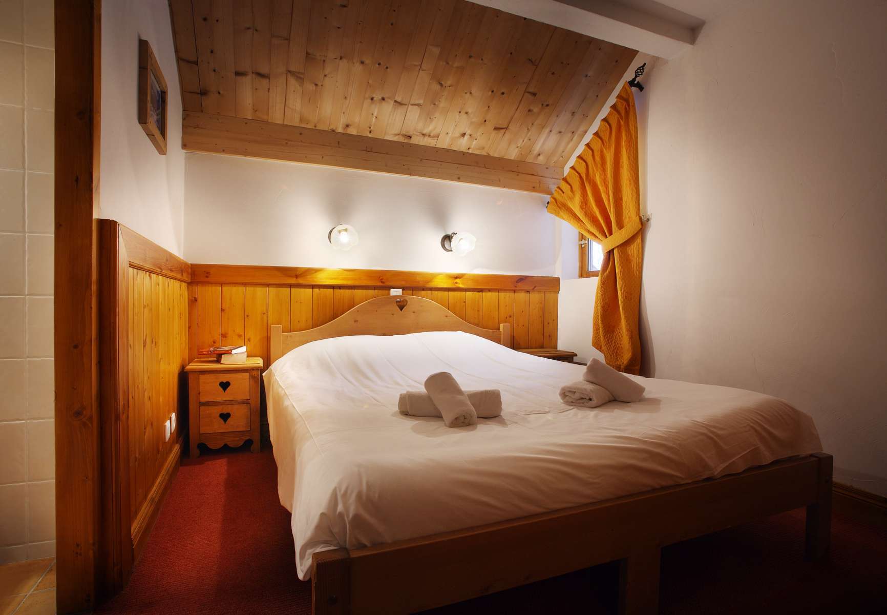 image Bedroom with bed, side table, and curtain
