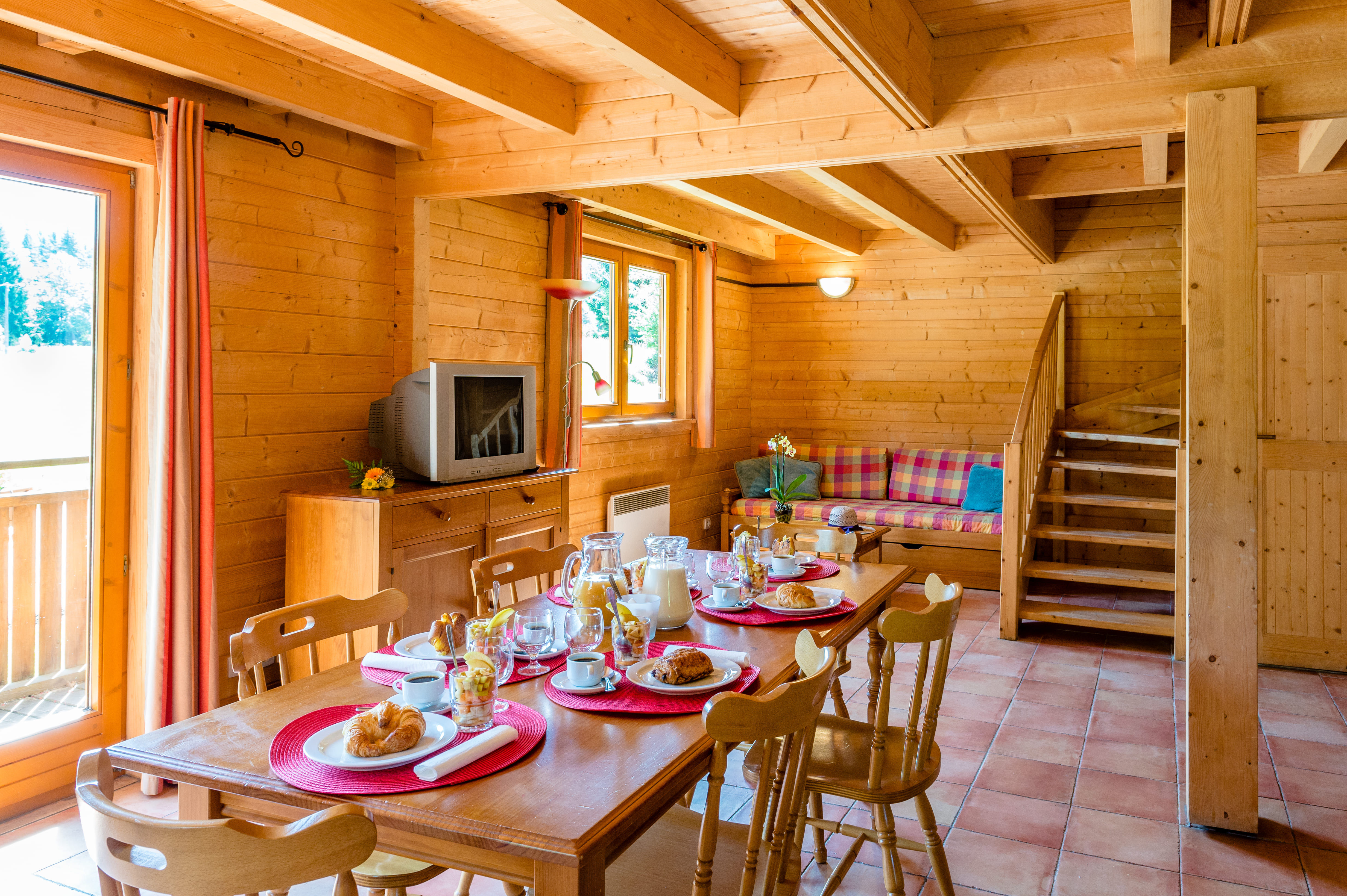 image Morning light fills the dining nook, set for a mountain breakfast.
