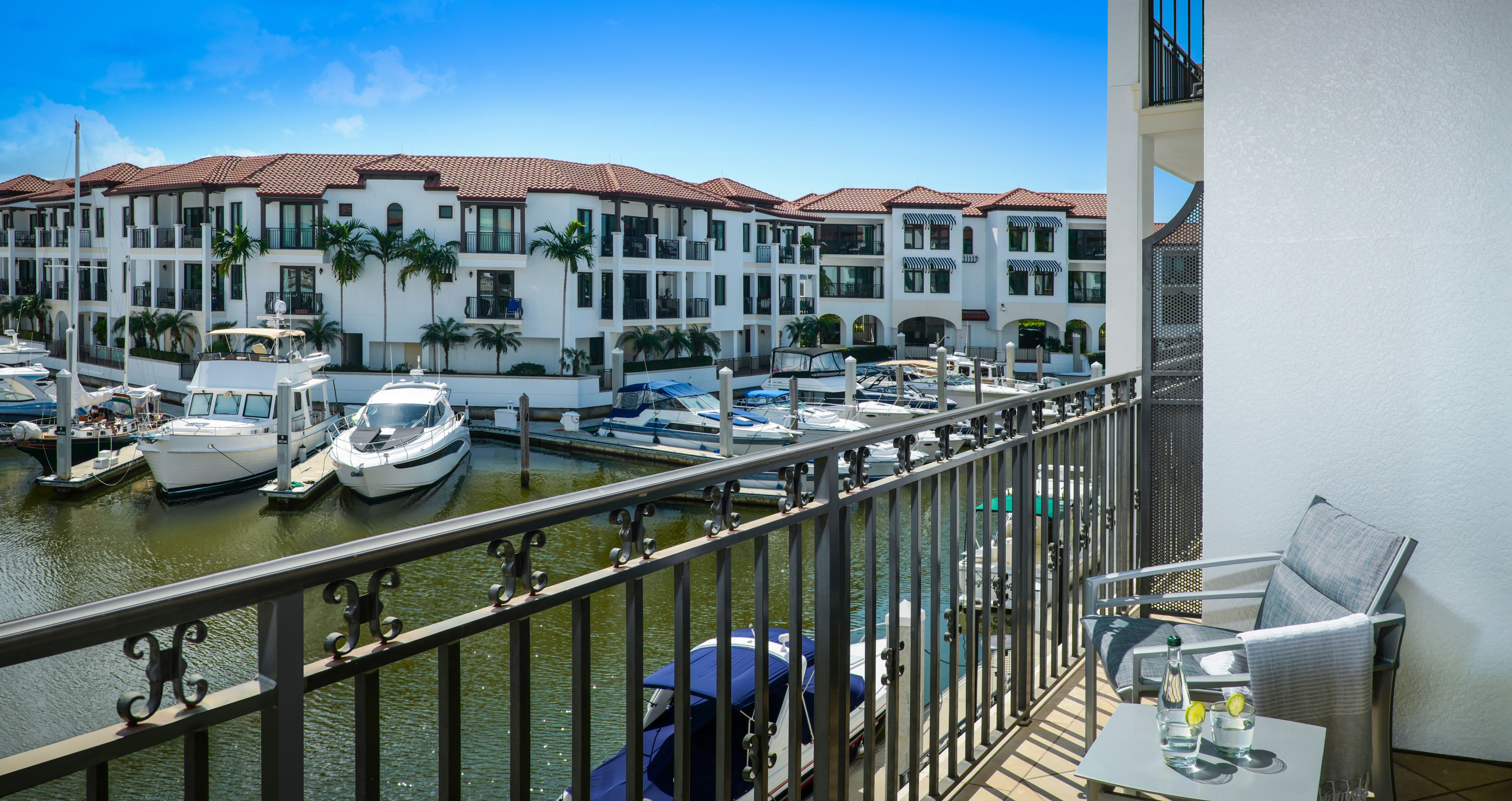 image Furnished balcony with seating overlooking the marina