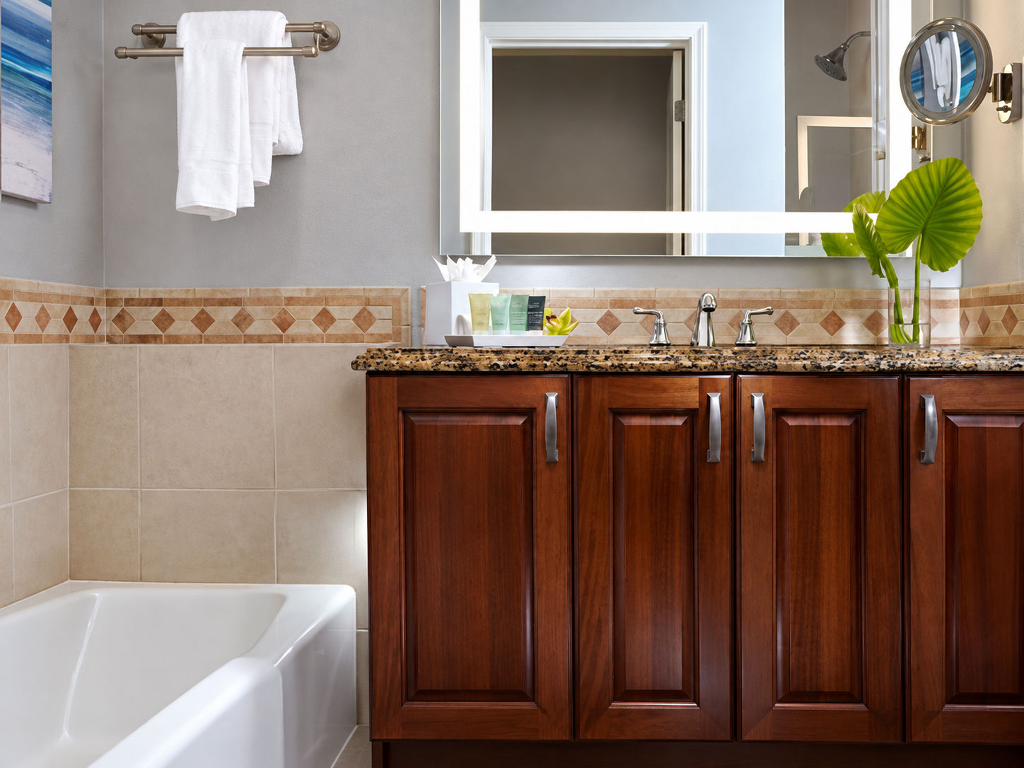 image Bathroom with sink, bathtub, and walk-in shower