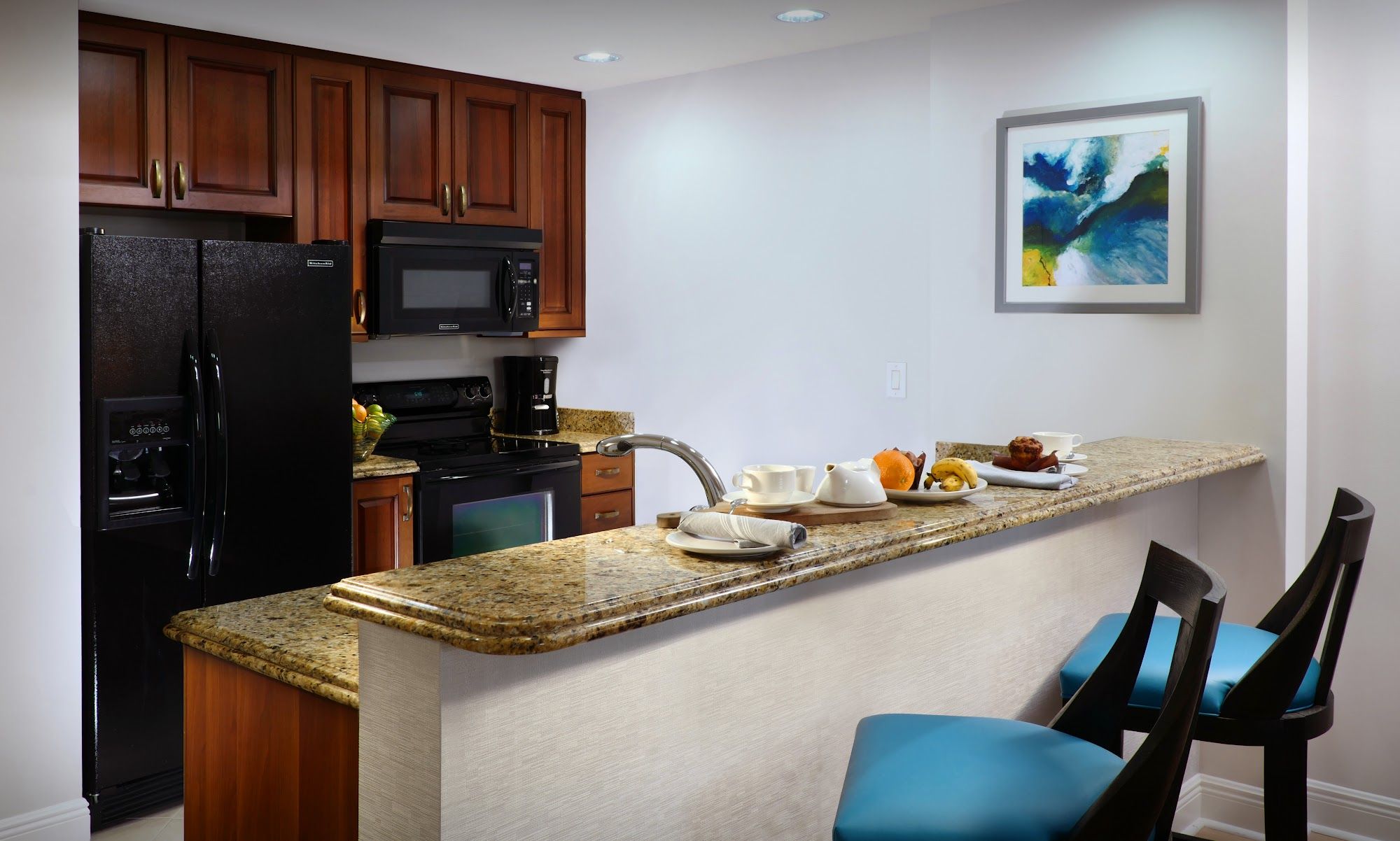 image Kitchen with refrigerator, microwave, and countertop workspace