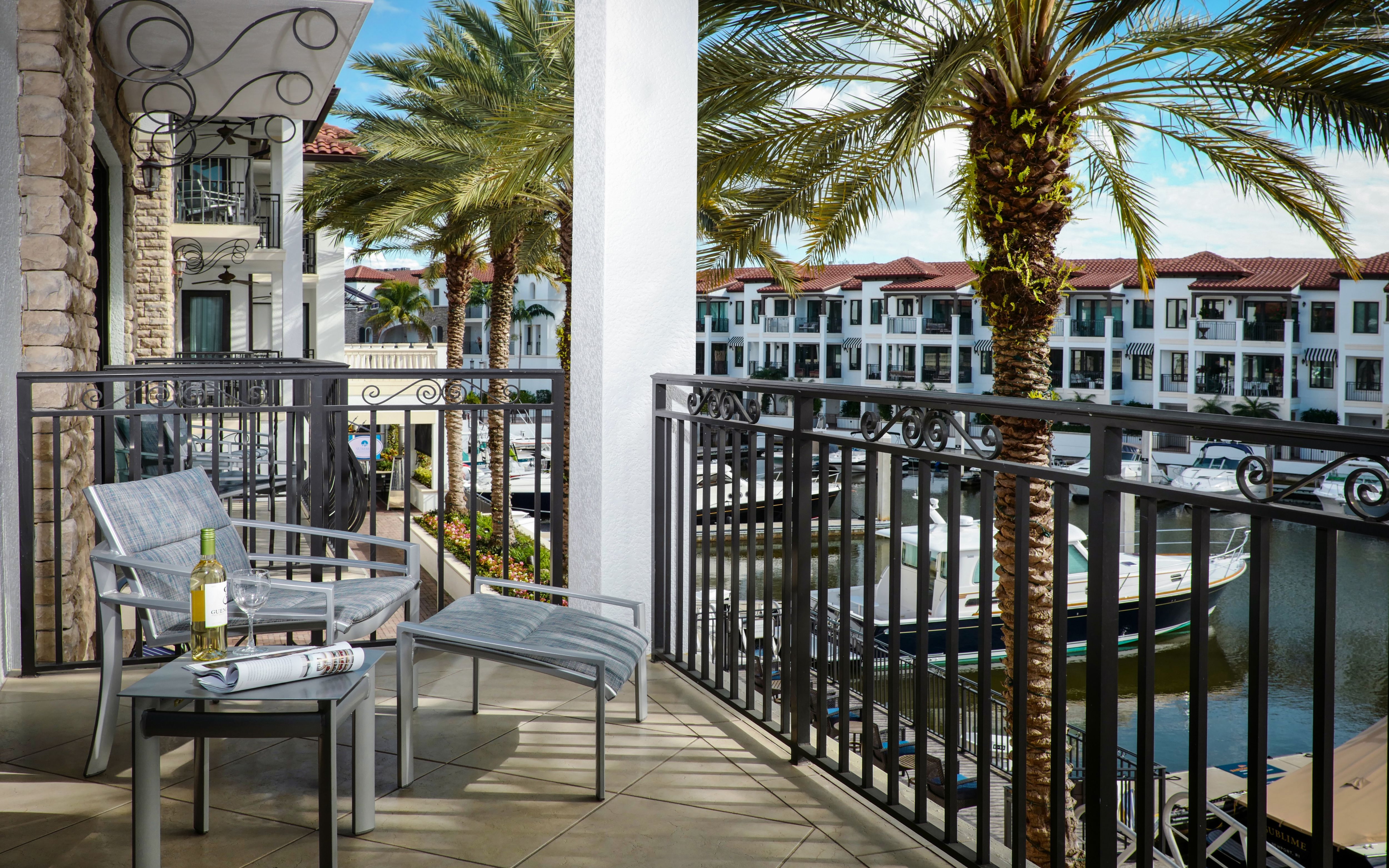 image Furnished balcony with seating overlooking the marina