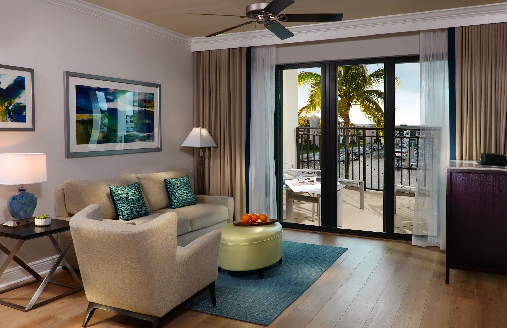 image Living room with ceiling fan, coffee table, and seating area