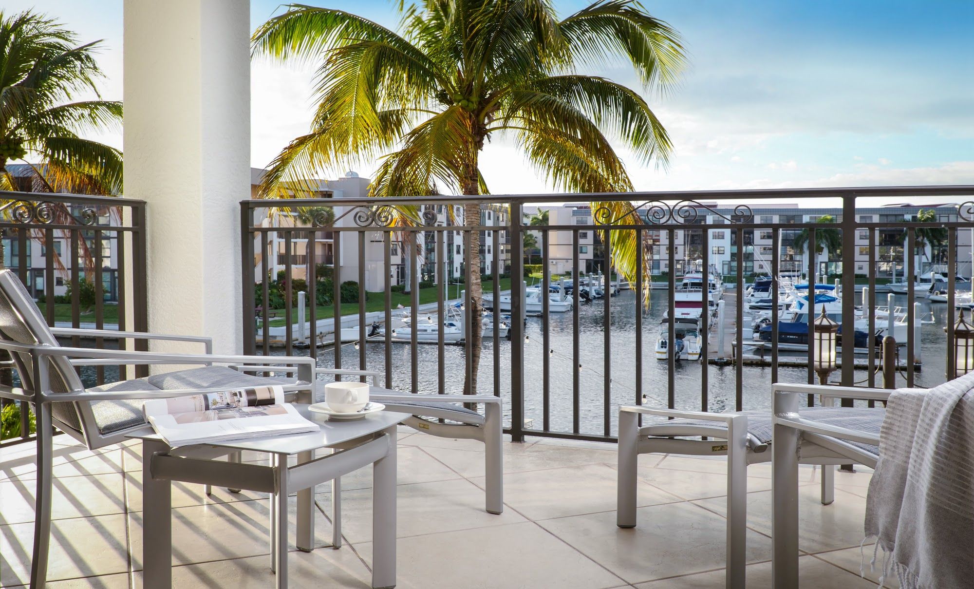 image Furnished balcony overlooking water with seating