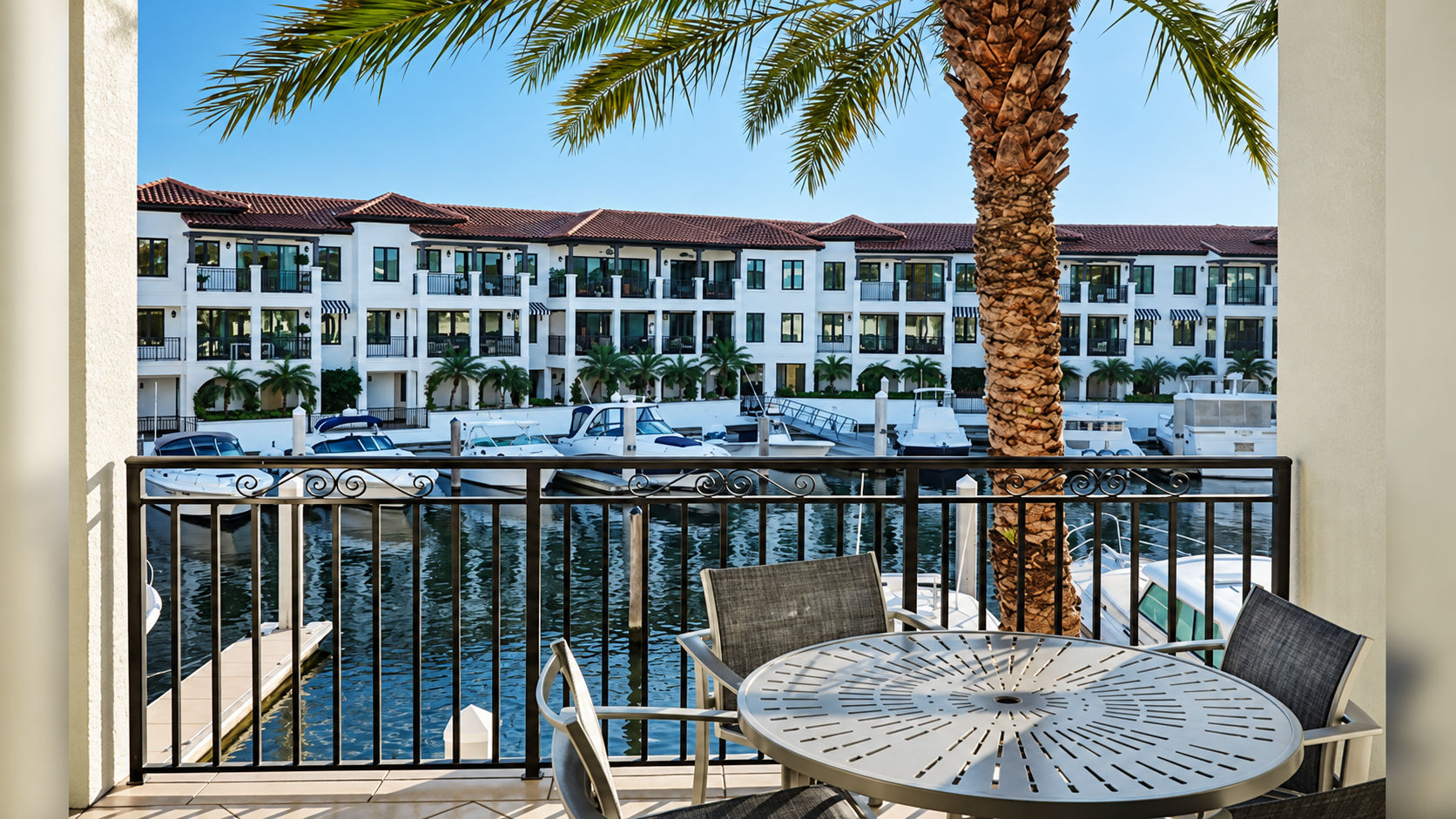 image Furnished balcony with seating overlooking the marina