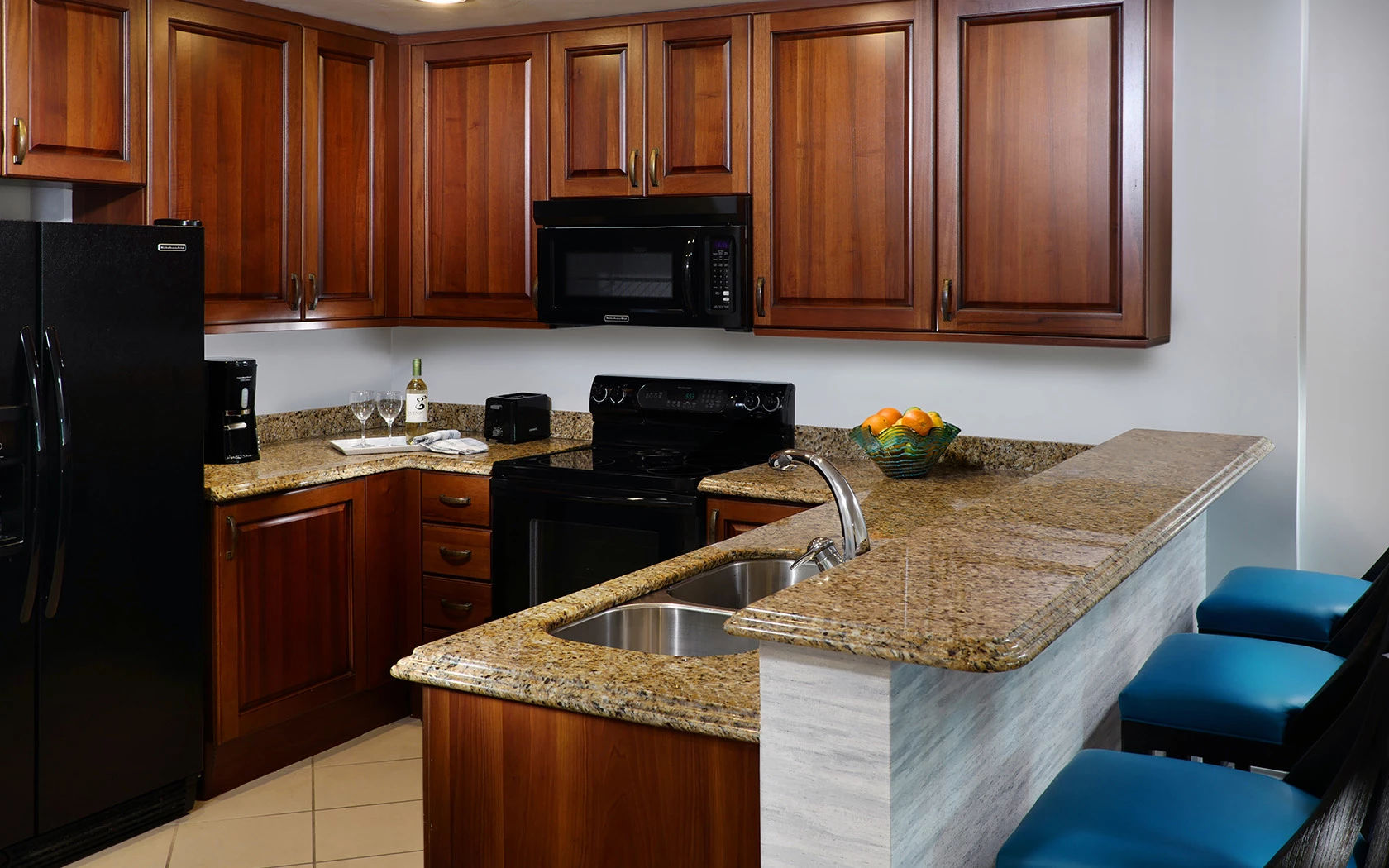 image Kitchen with refrigerator, microwave, and countertop workspace