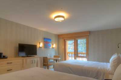 Relax on the two luxurious queen-sized beds after a day outside.