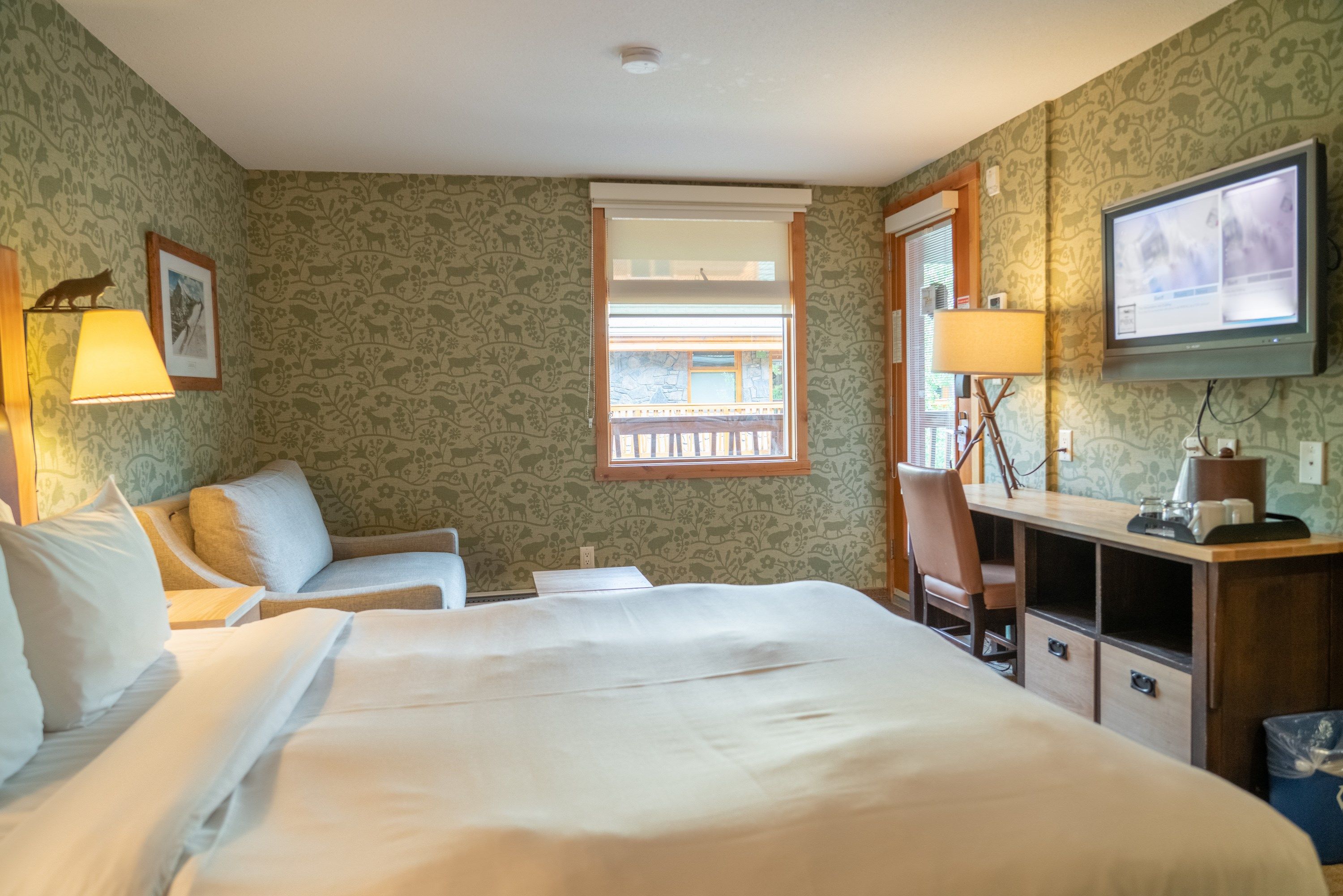 image Take in views of the courtyard from this rustic and warmly decorated room.