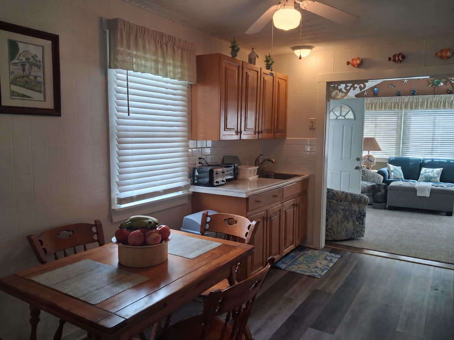 image Inviting dining area with wooden furnishings and an adjoining living room