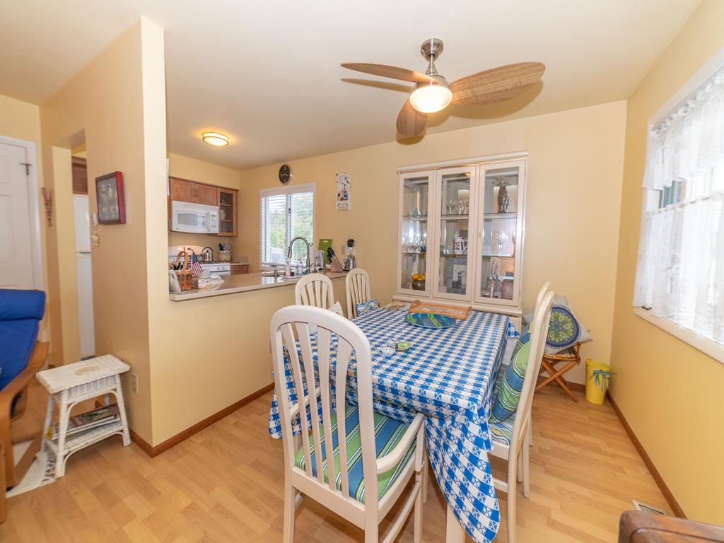 image Dining area with table and chairs open to the kitchen