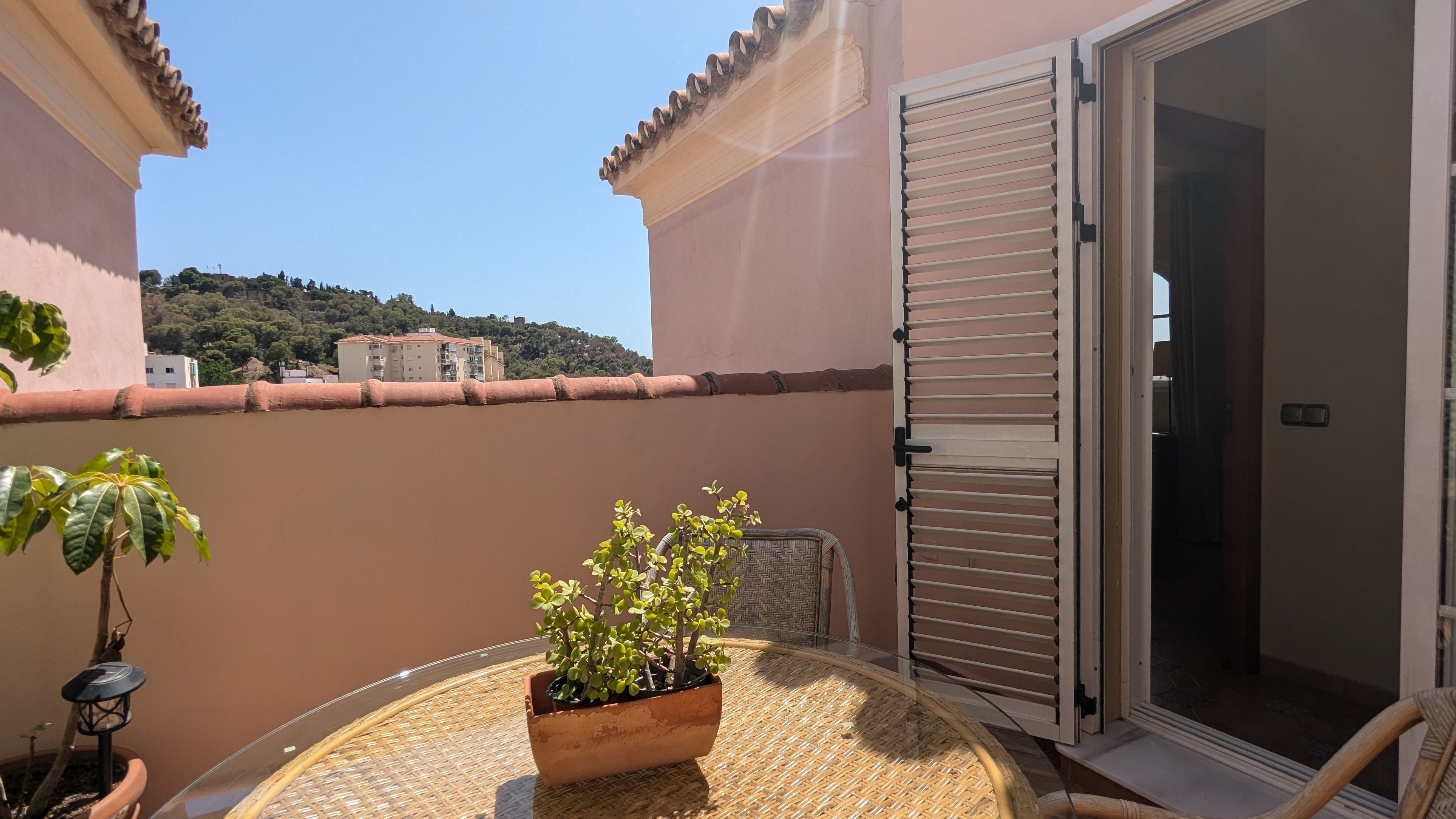 image Balcony with table and plants, with city air