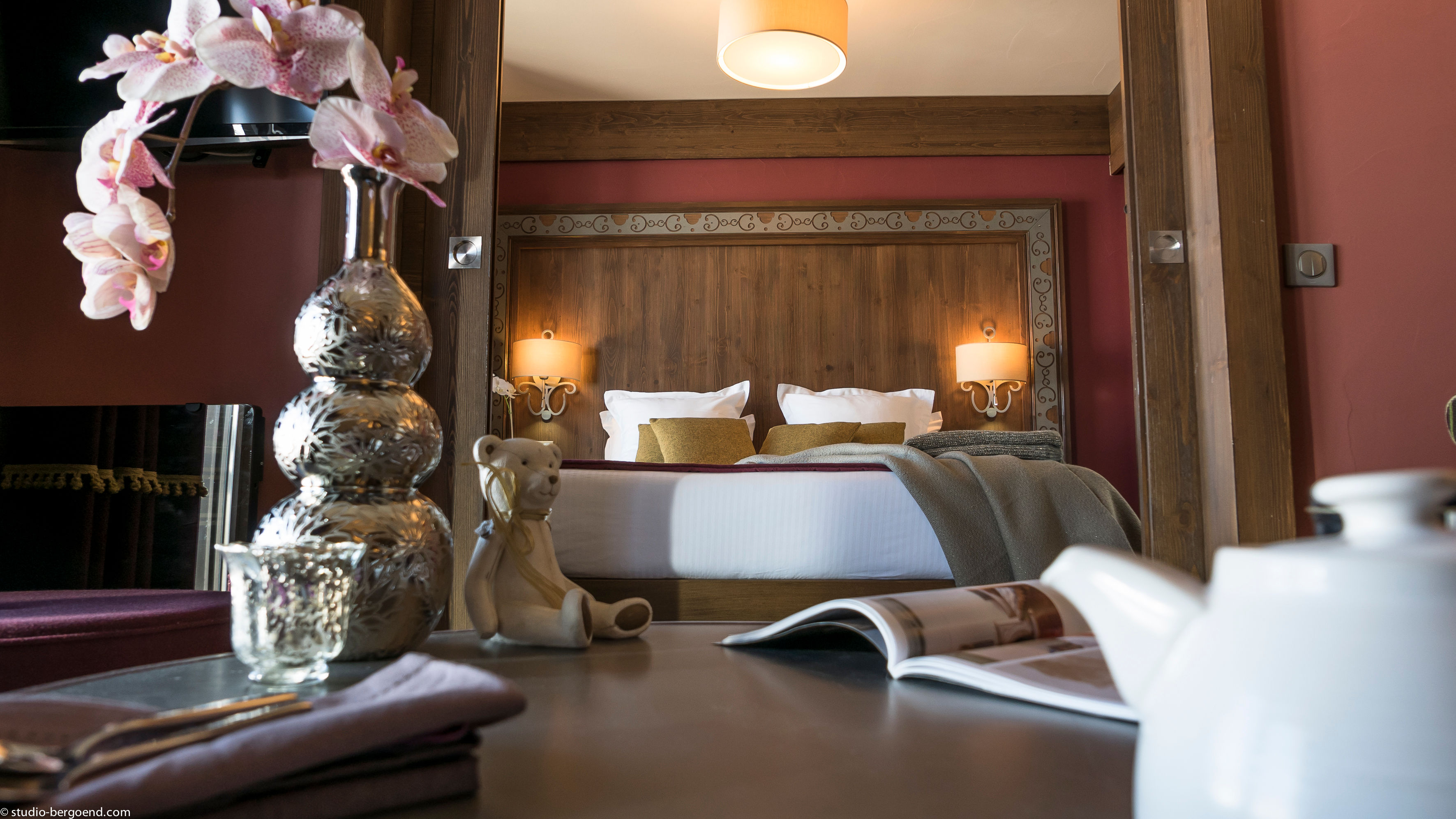 image Warm wood and soft light make the bedroom a restful end to a day in the mountains.
