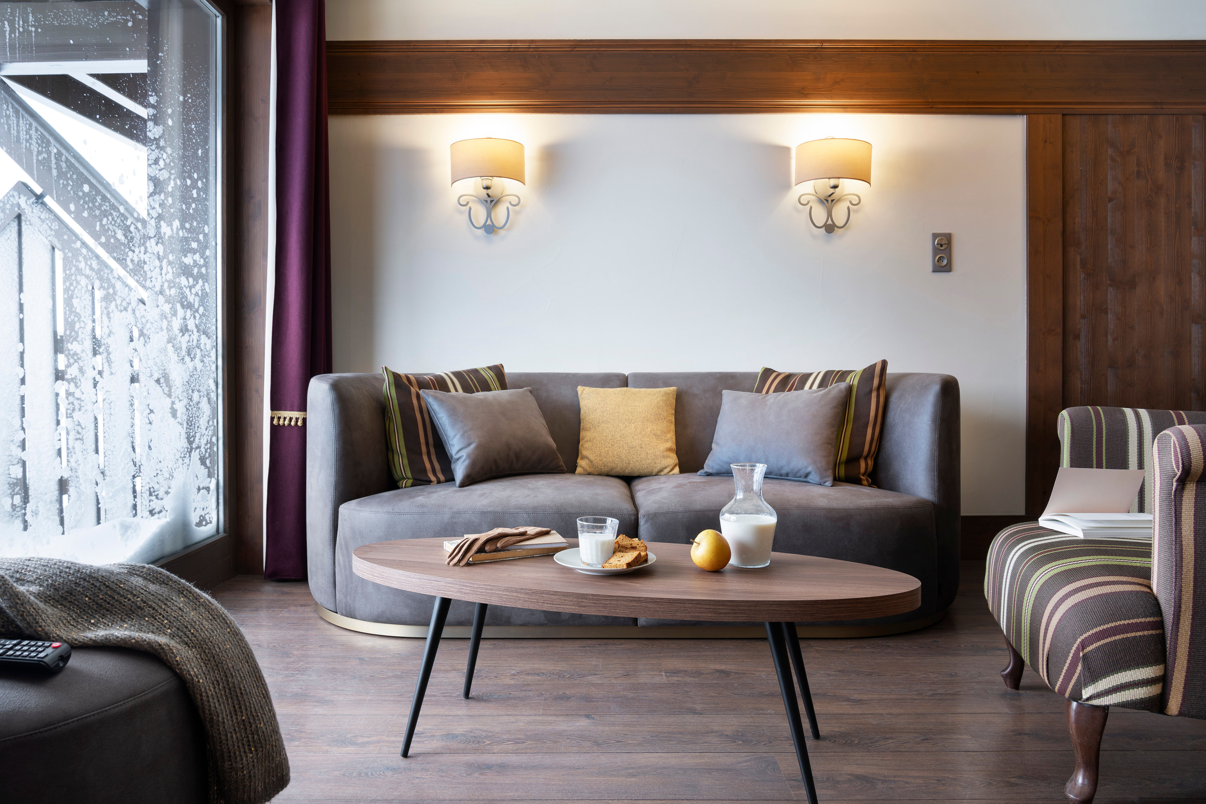 image Back from the pistes, the living room carries the warm, Himalayan-inspired spirit of the residence.