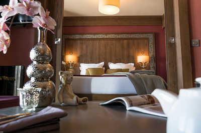 Bedside lamps and warm tones set a restful pace after a day at altitude.