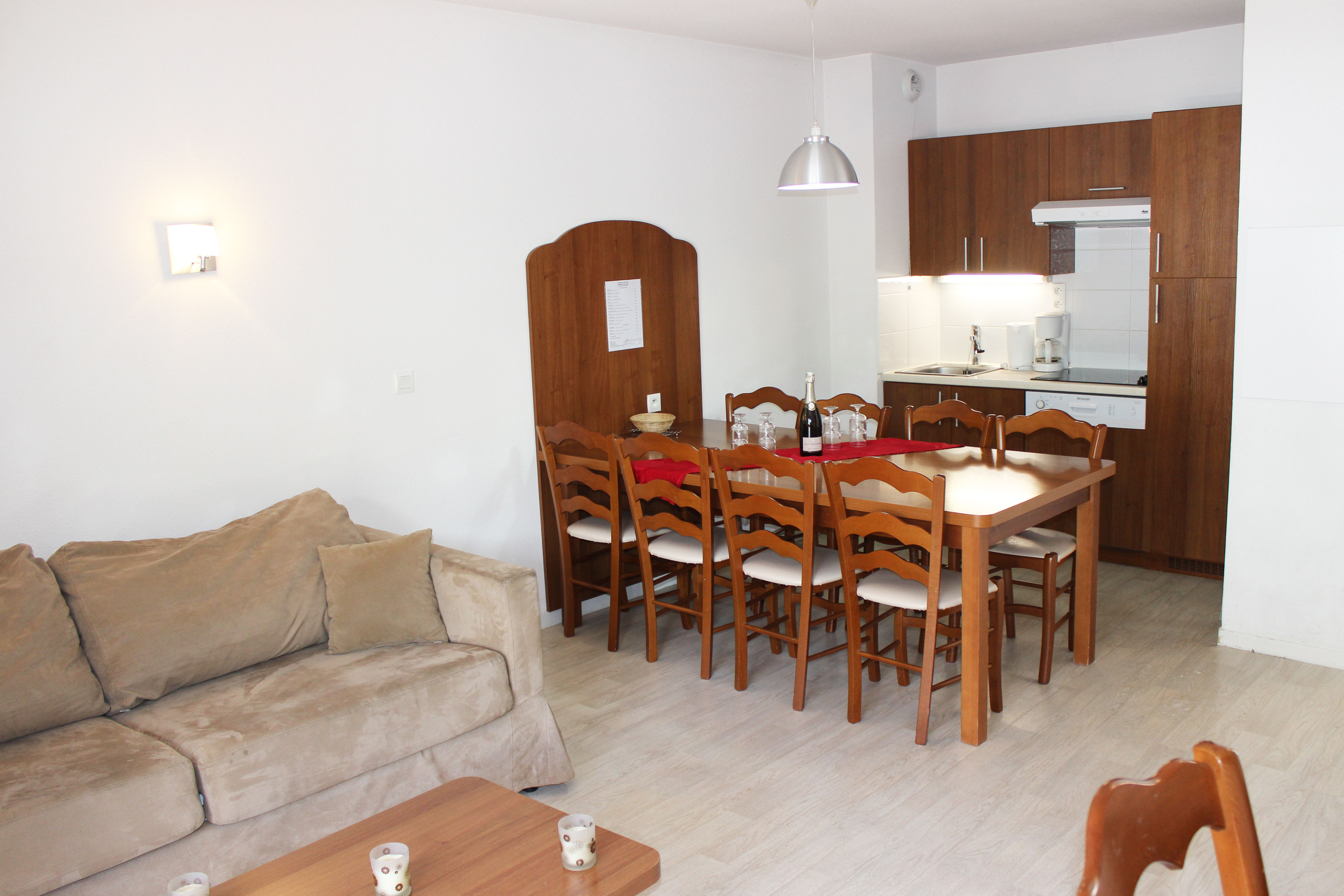 image Gather around the charming dining table for delightful meals together.