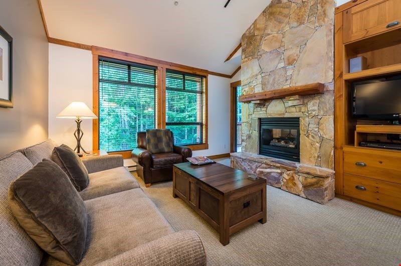 image Kick up your feet and relax in the spacious living area after a day on the slopes.