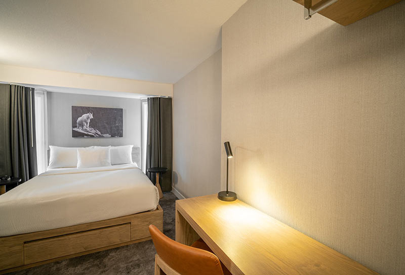 image A tranquil bedroom space bathed in soft lighting, offering an intimate retreat for peaceful evenings.