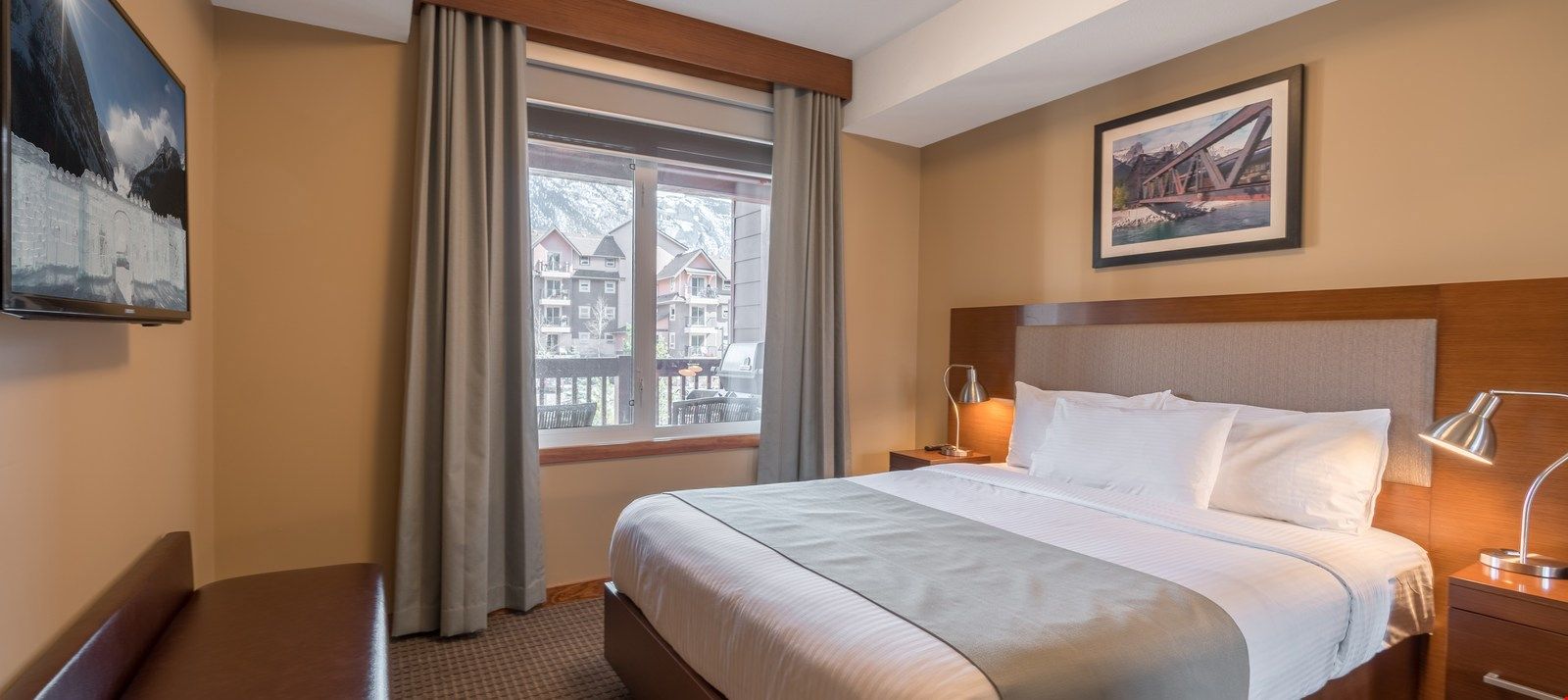 image Relax and watch TV in bed after a fun day on the town.
