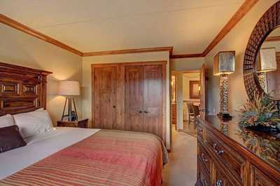 The bedroom is spacious and provides ample cupboard and storage space for your belongings.