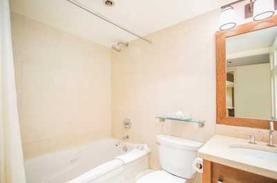 Get ready for the day in the modern and bright bathroom.