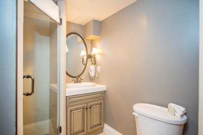 Get ready for the day in the modern and bright bathroom.