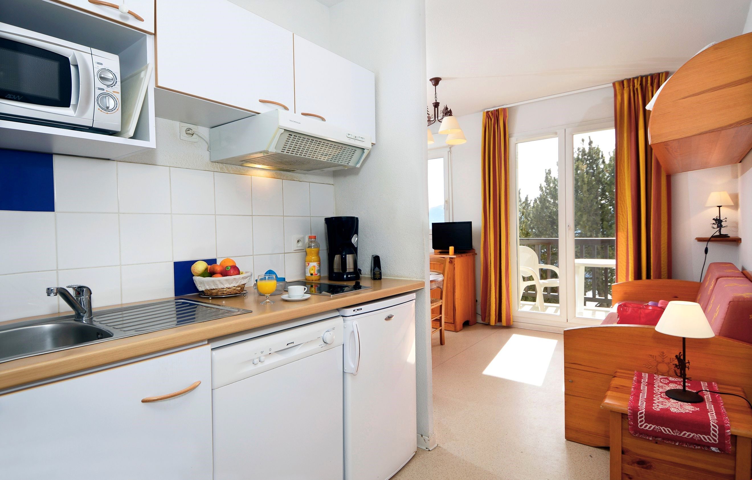 image Tuck into a snack you’ve prepared in your kitchenette.