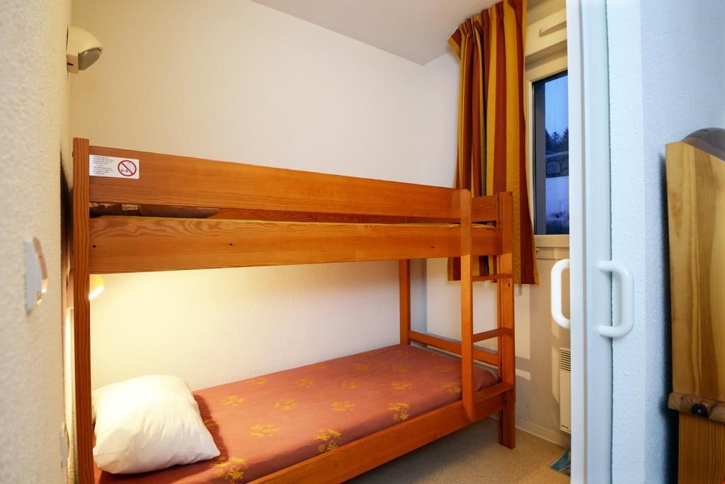 image The sleeping alcove includes a trunk bed for 2 additional guests