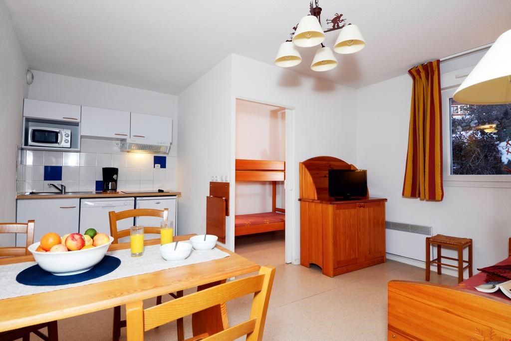 image Prepare your meals in the kitchenette and enjoy them around the dining table with seating for everyone