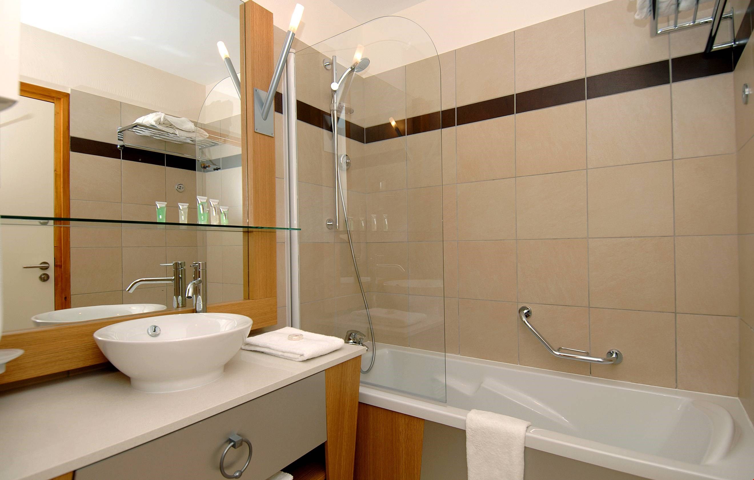image Prepare for the day in the bright, modern bathroom.