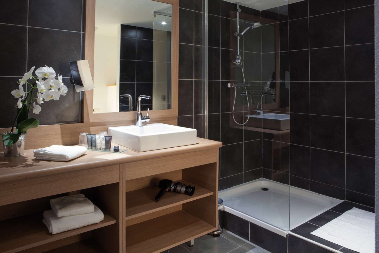 image Get ready for the day in the bathroom, which features a shower.