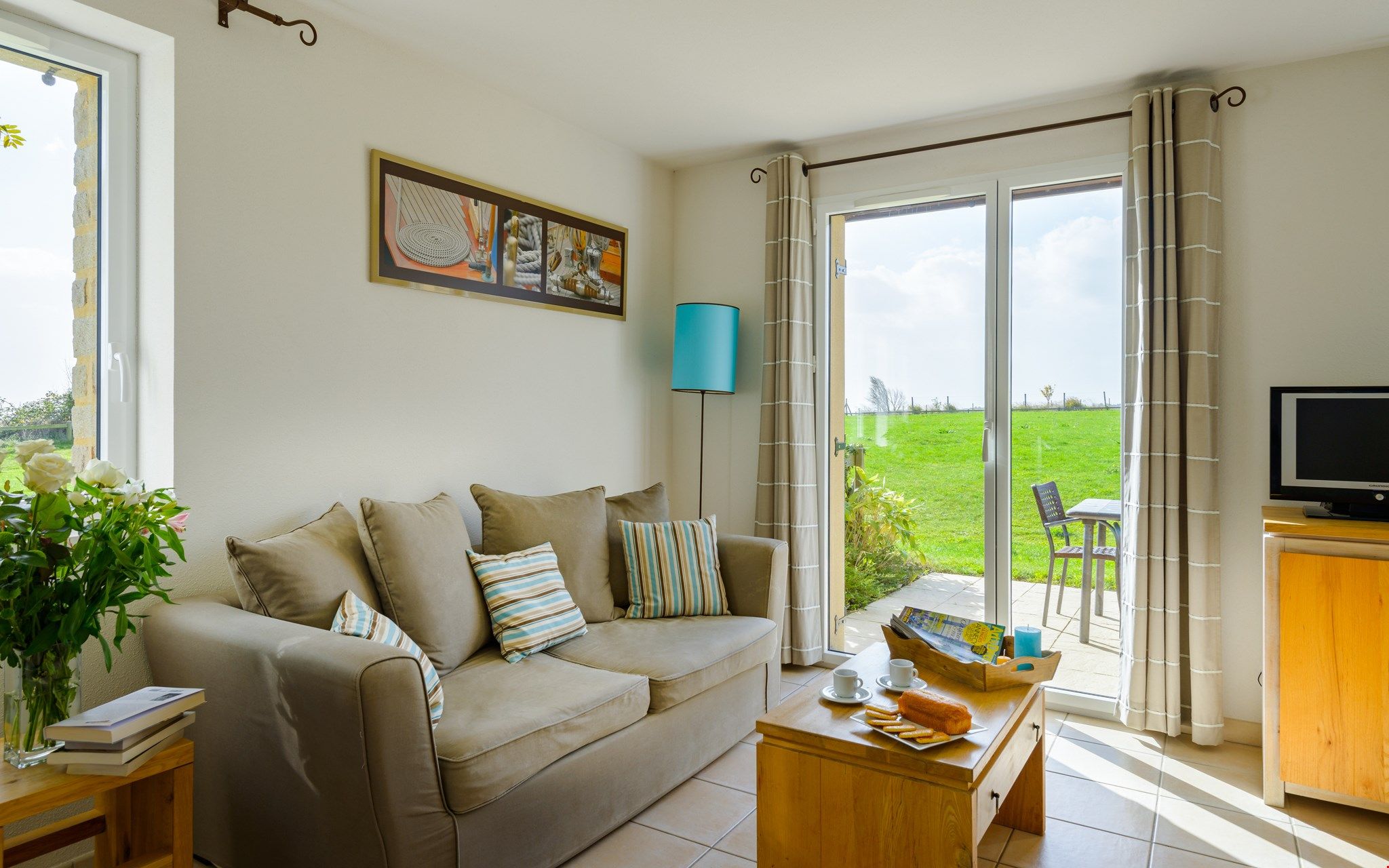 image Find peace and relaxation with your close friends and family in this stunning open-concept living room featuring natural decor.