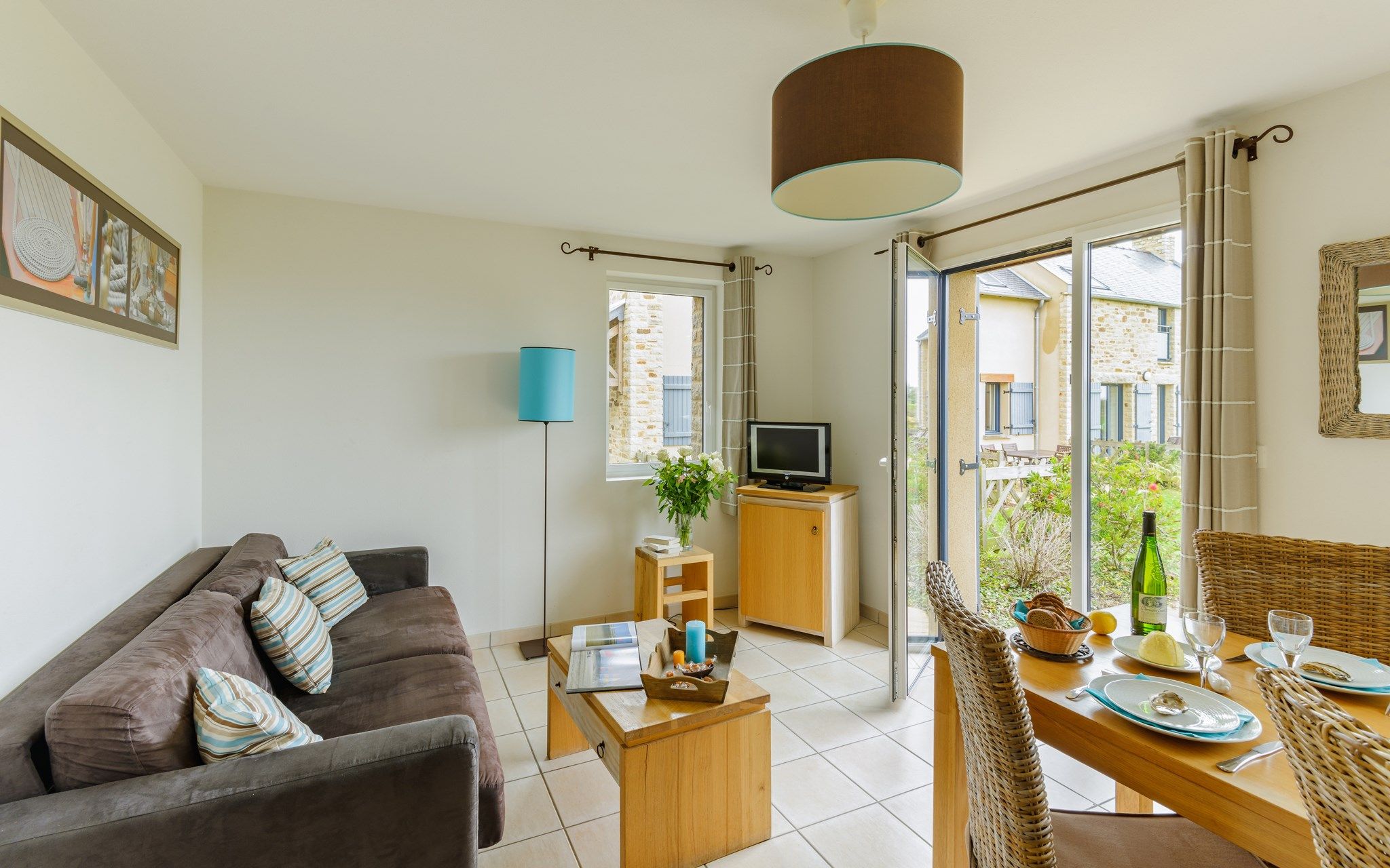 image Find peace and relaxation with your close friends and family in this stunning open-concept living room featuring natural decor.