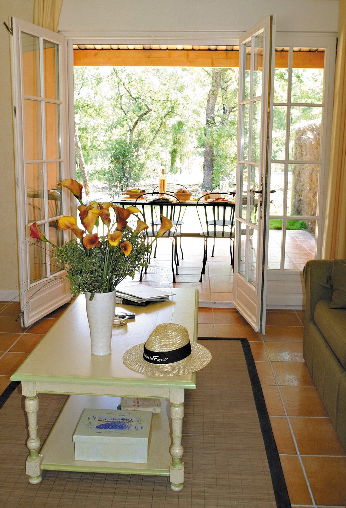 image Large doors and floor-to-ceiling windows provide plenty of light to this home.