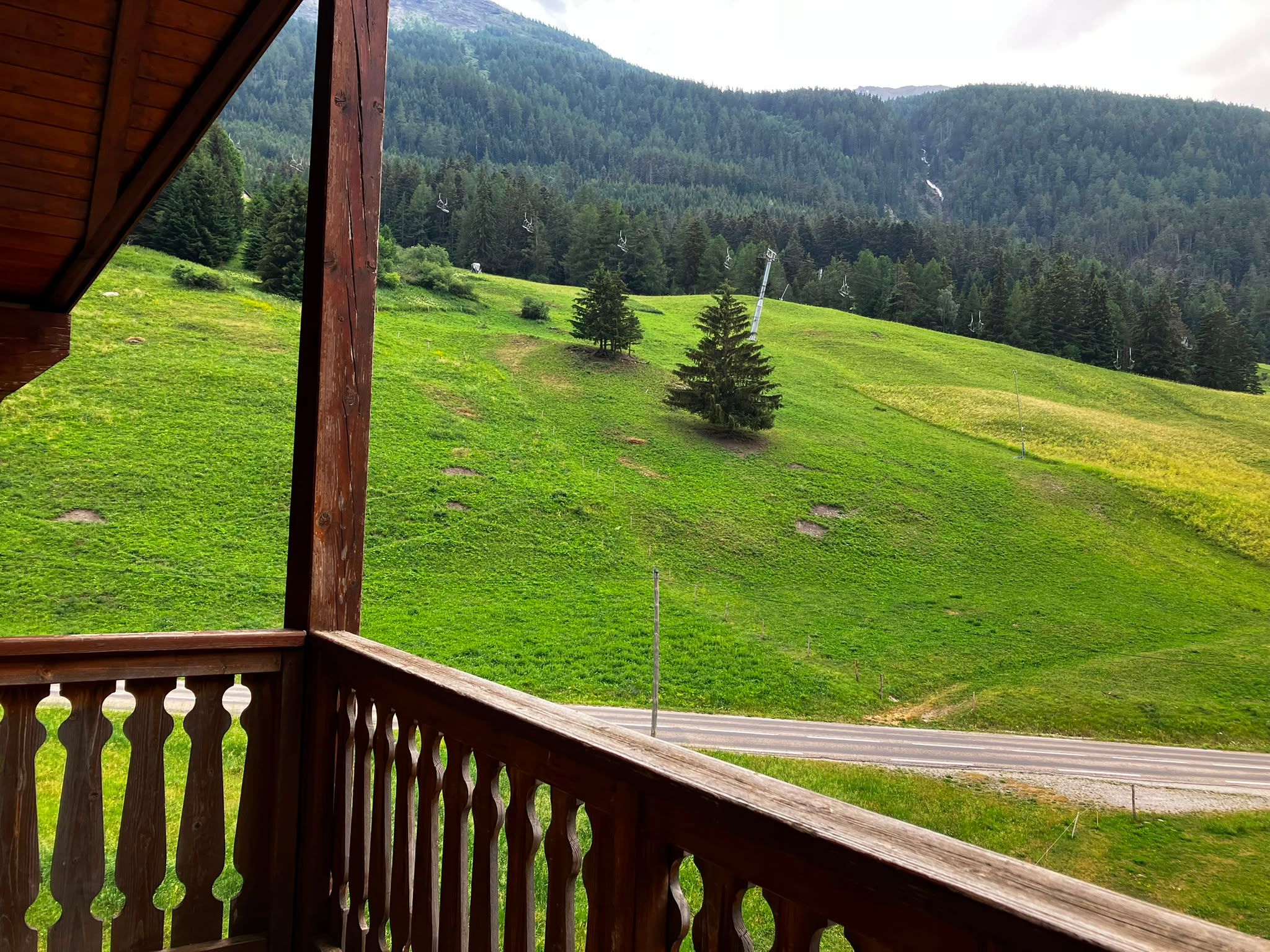 image Gaze upon green hills from your private balcony over morning coffee
