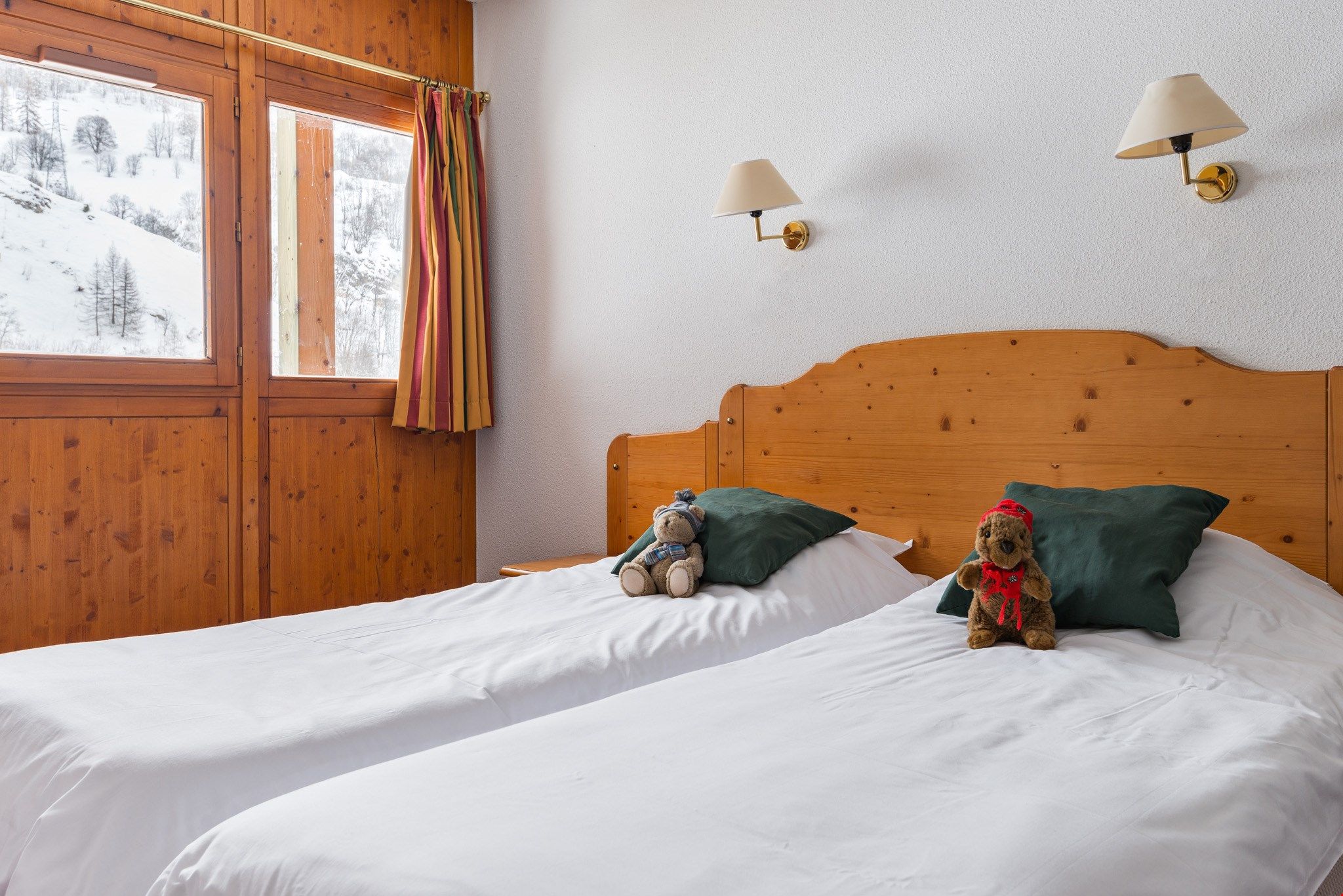 image Two bedrooms feature 2 Single beds each, and there are 2 Single beds in the alcove.