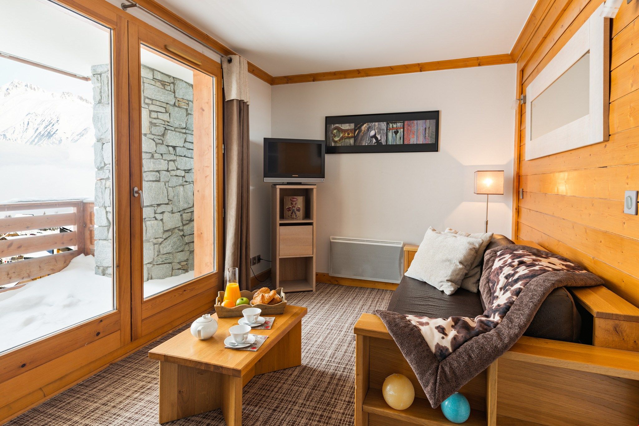 image Our apartment is ideal for families or groups of 4, and features warm and inviting decor.
