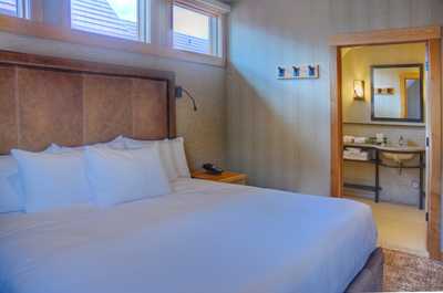 The bright and spacious bedroom features a luxurious king-sized bed.