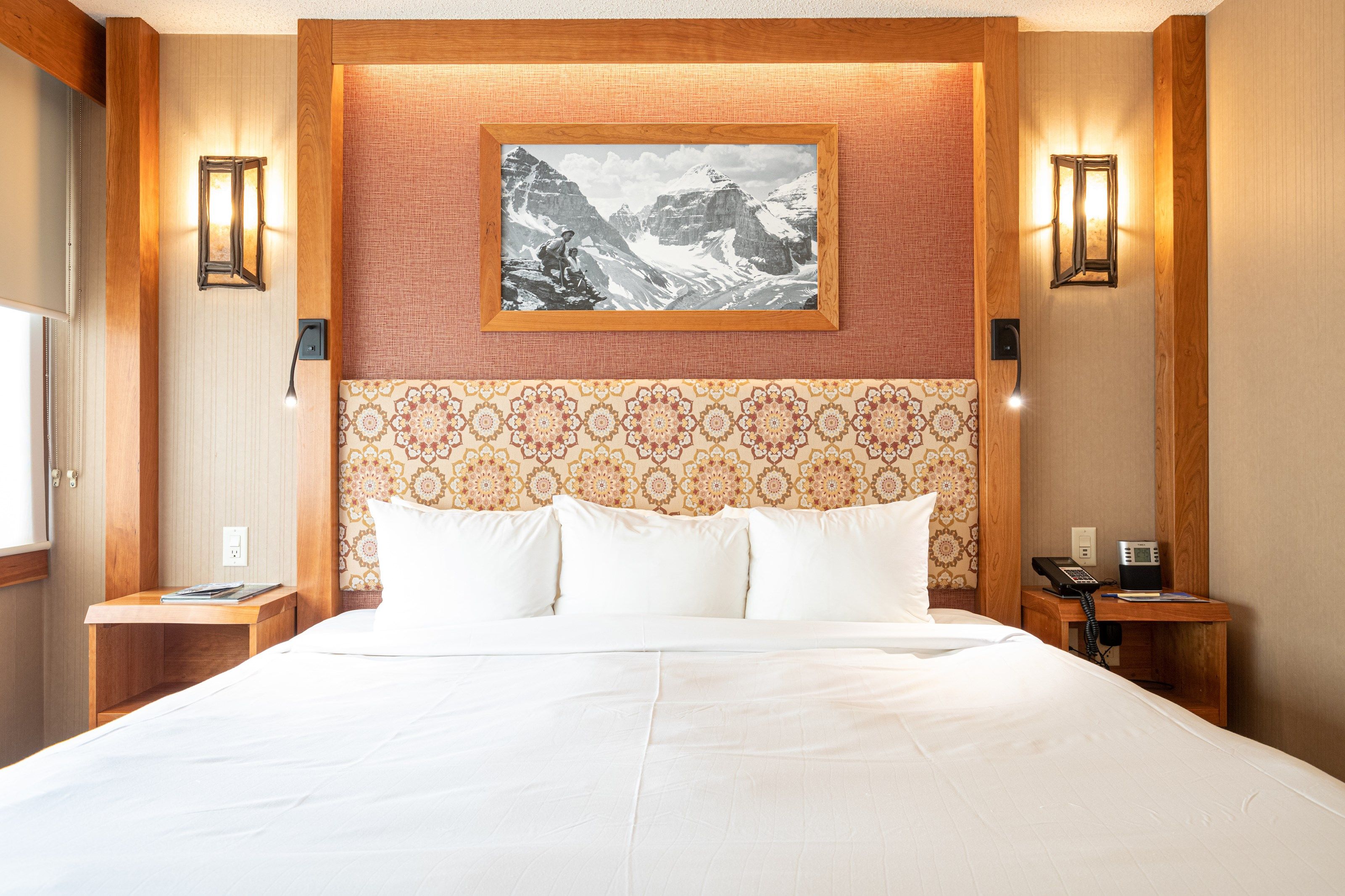 image Get a sumptuous night sleep on the plush king-sized bed in this beautiful mountain room.